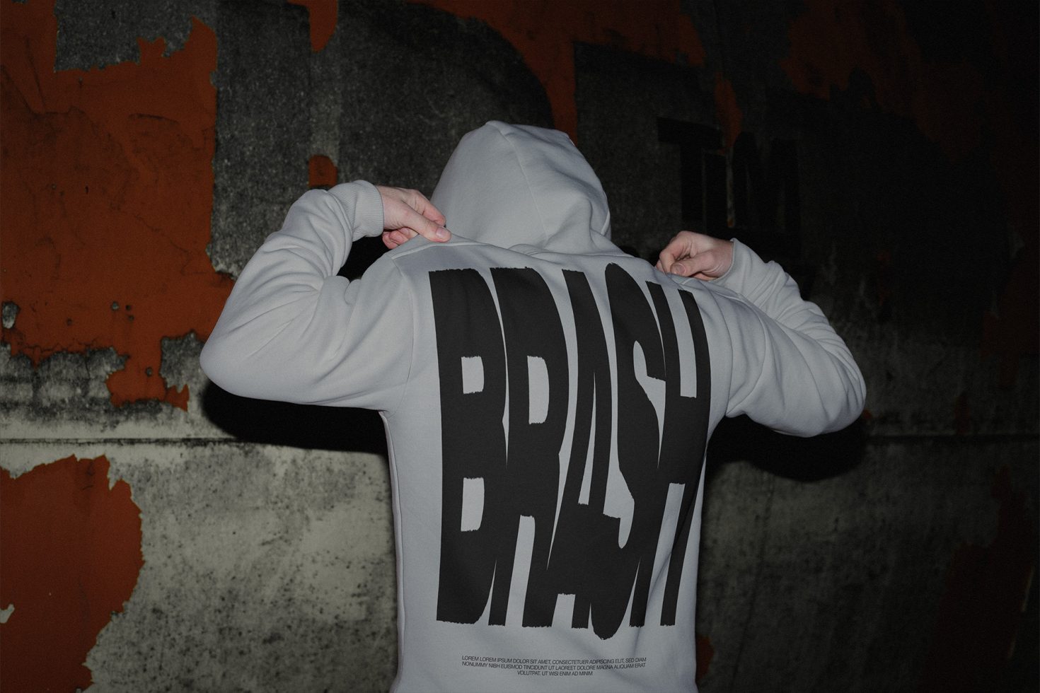 Person in hoodie mockup showing bold typography design on the back, useful for graphic designers' apparel presentations.